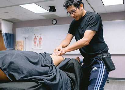 Student massaging a client