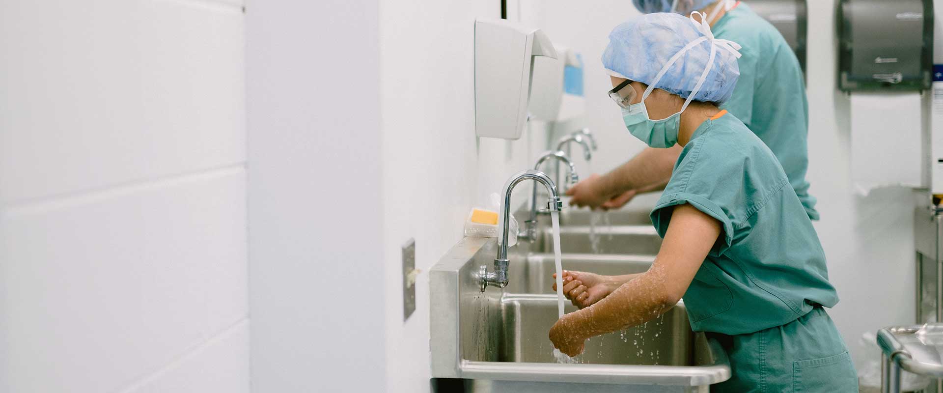 Photo of CLC surgical technology students scrubbing in.