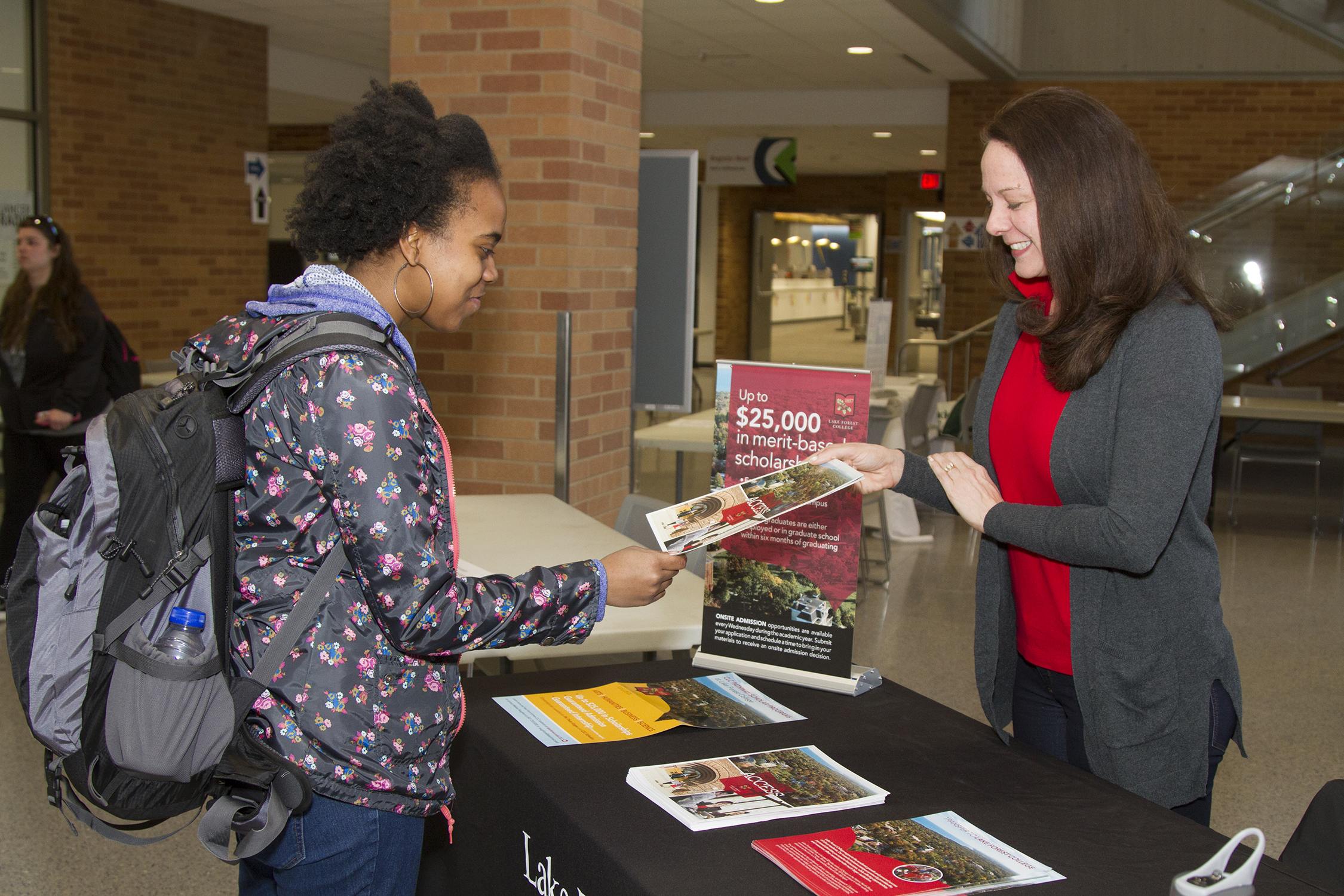 Student talking to a college rep