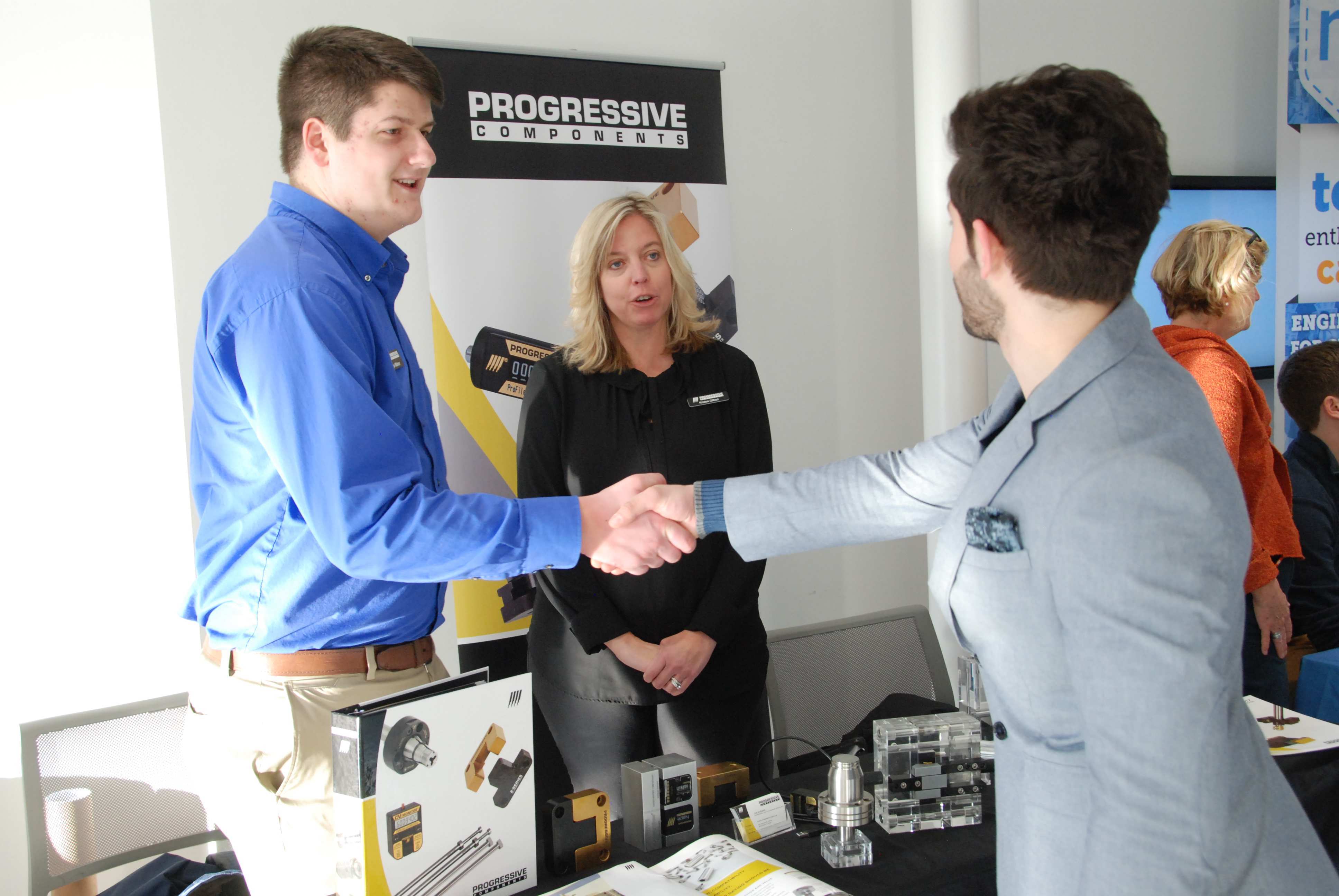 A student talking to an employer at a job fair