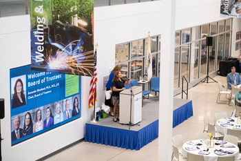 A wide shot of Dr. Suddick talking