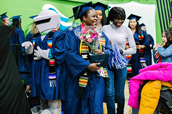 A graduate with flowers