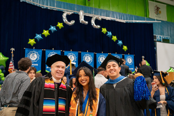 People posing by stage