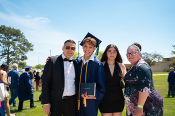 A family posing outside