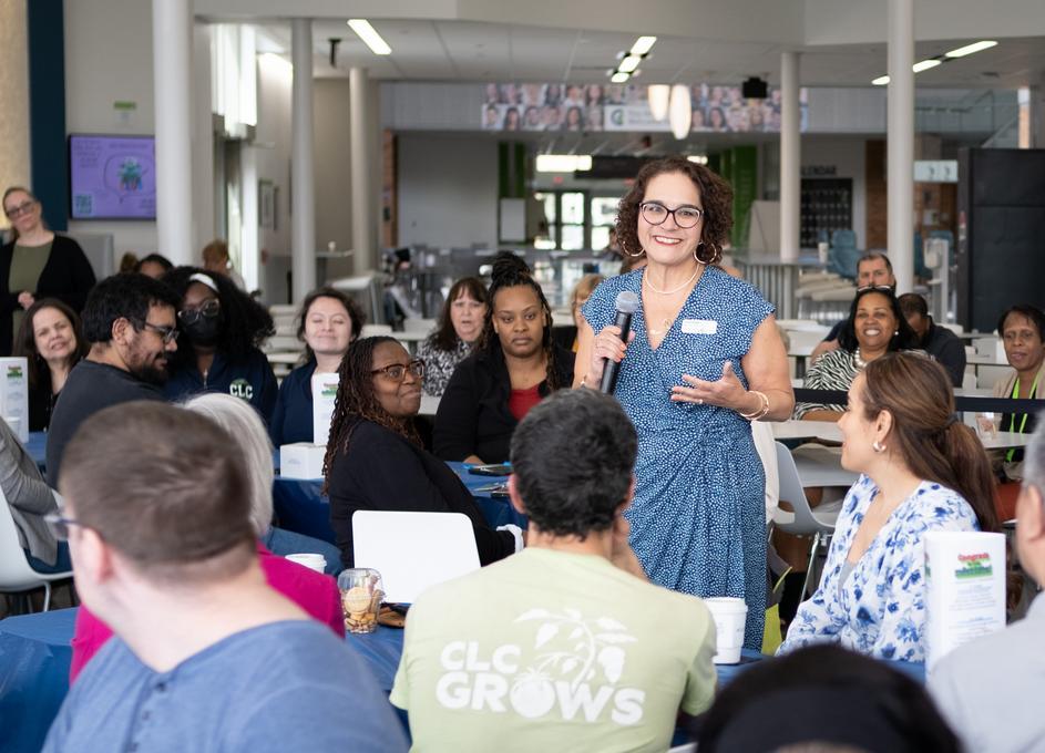 Tricia talking to her colleagues at an event