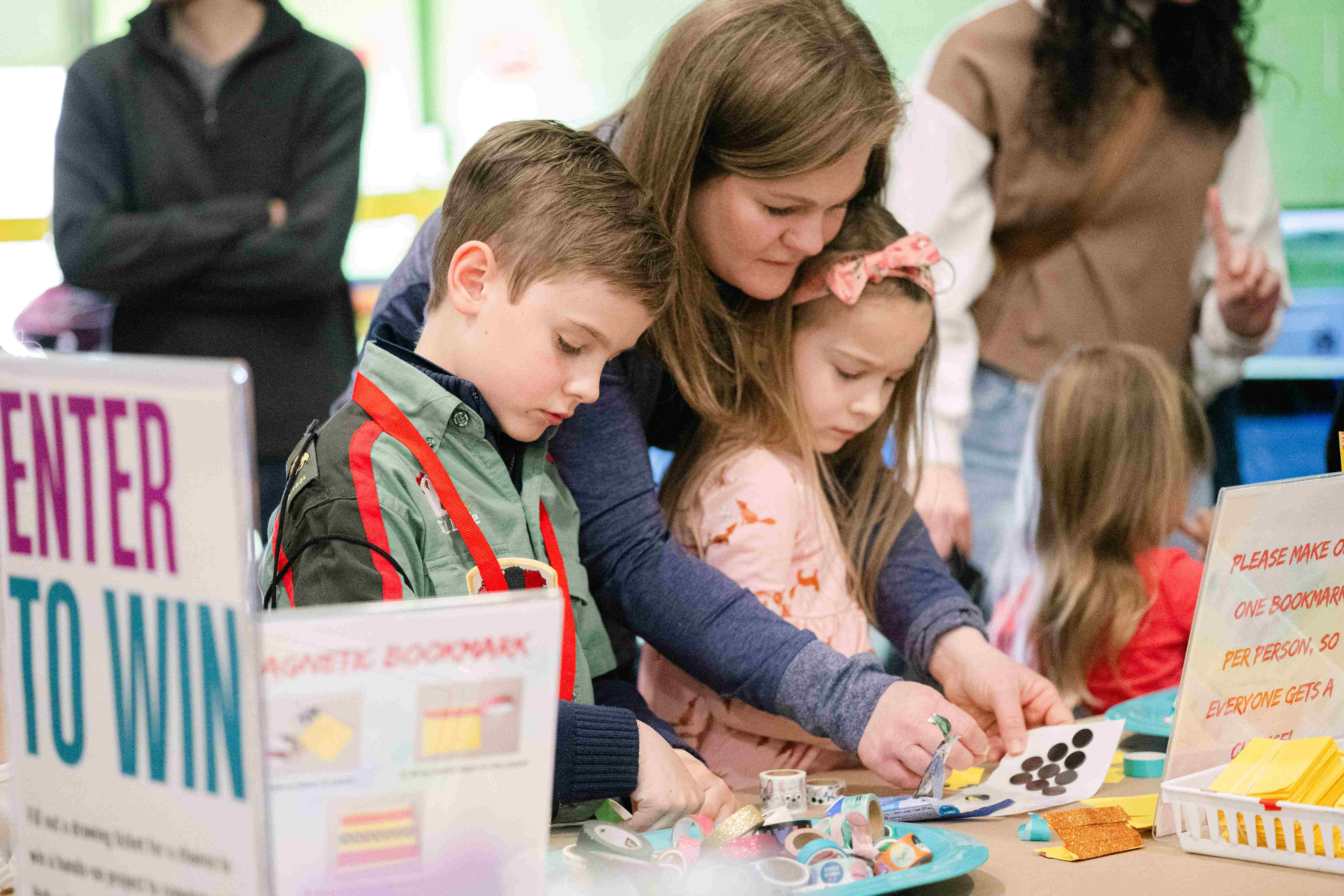 A parent and kids at Maker Faire