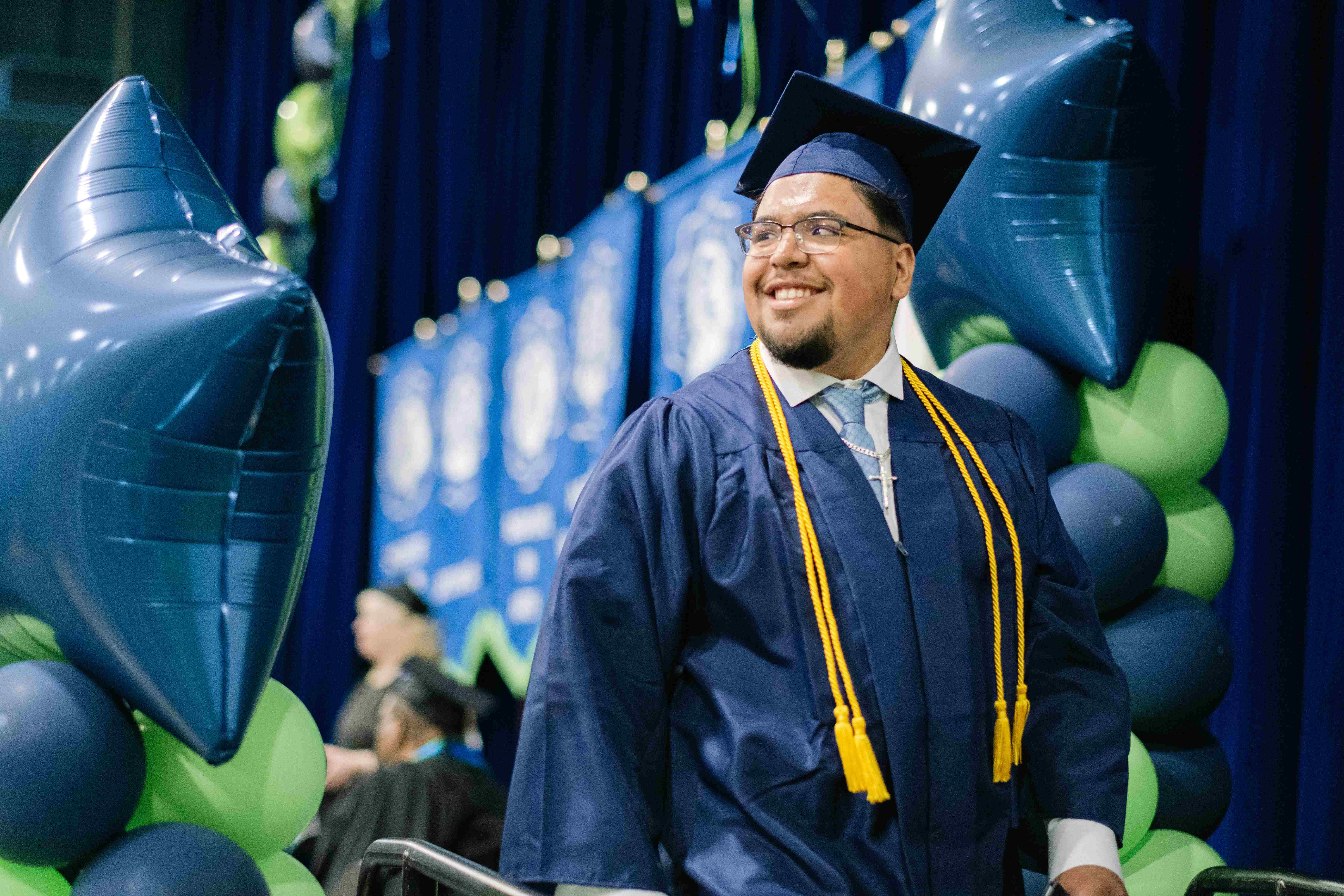 Graduate walking the stage
