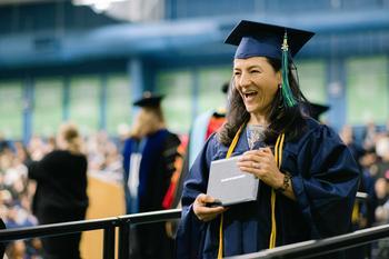A happy graduate with her diploma