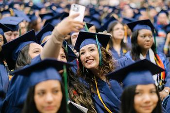 Graduates taking a selfie together