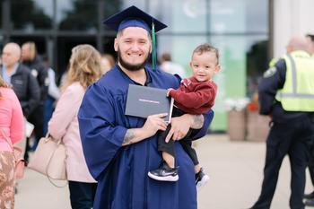A graduate with his son