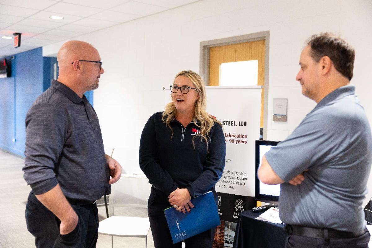 People talking at a job fair