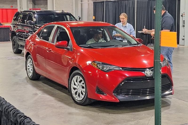 A student with a car competing