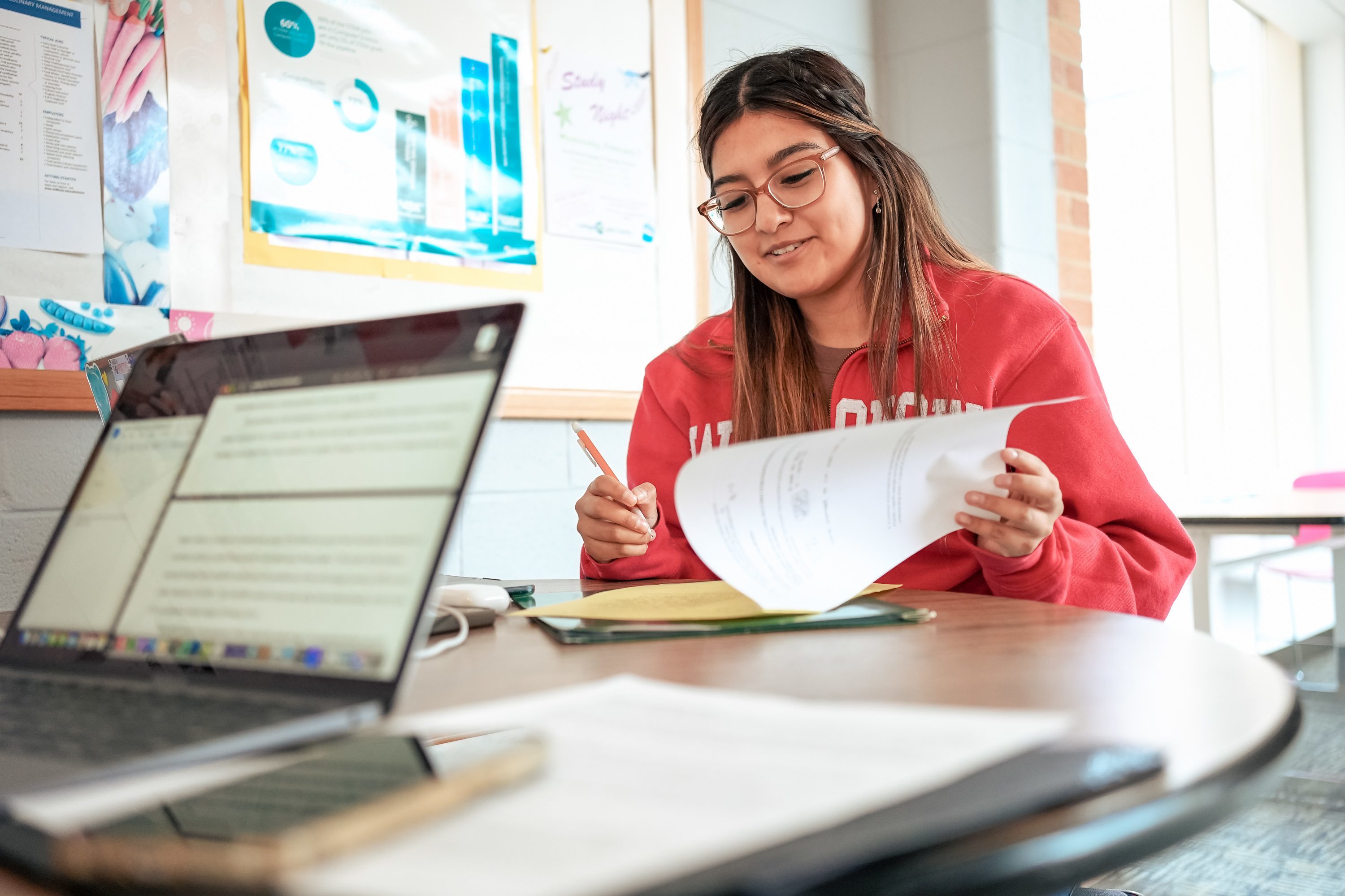 A student studying at a table in the halls