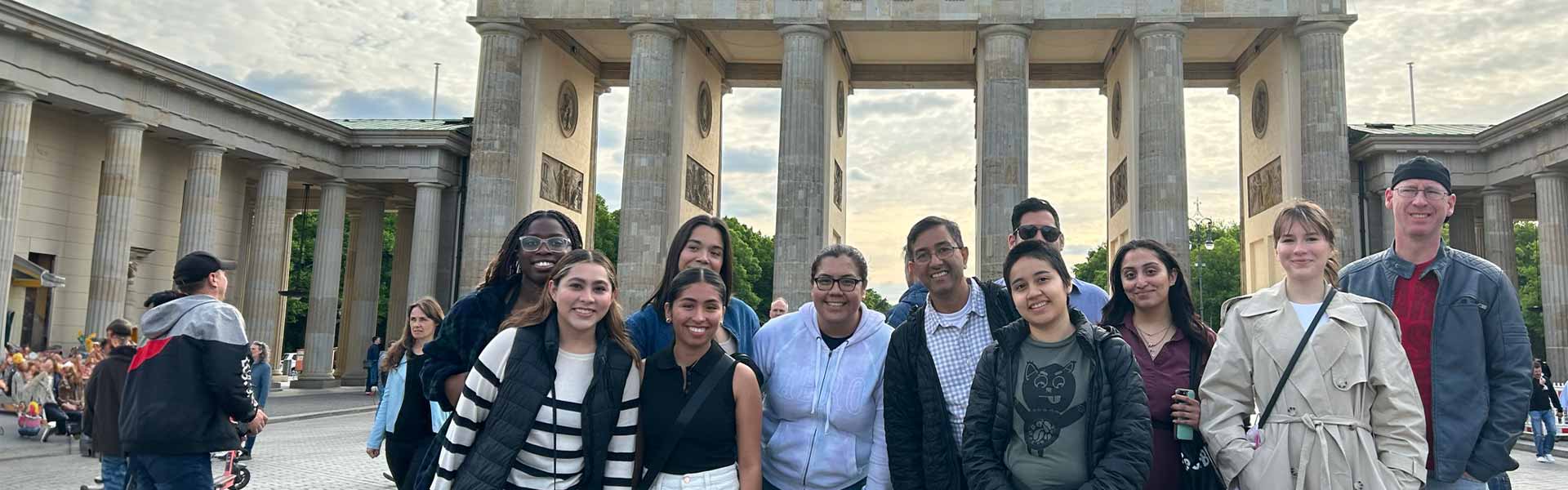 A group of study abroad students in front of the Brandenburg Gate