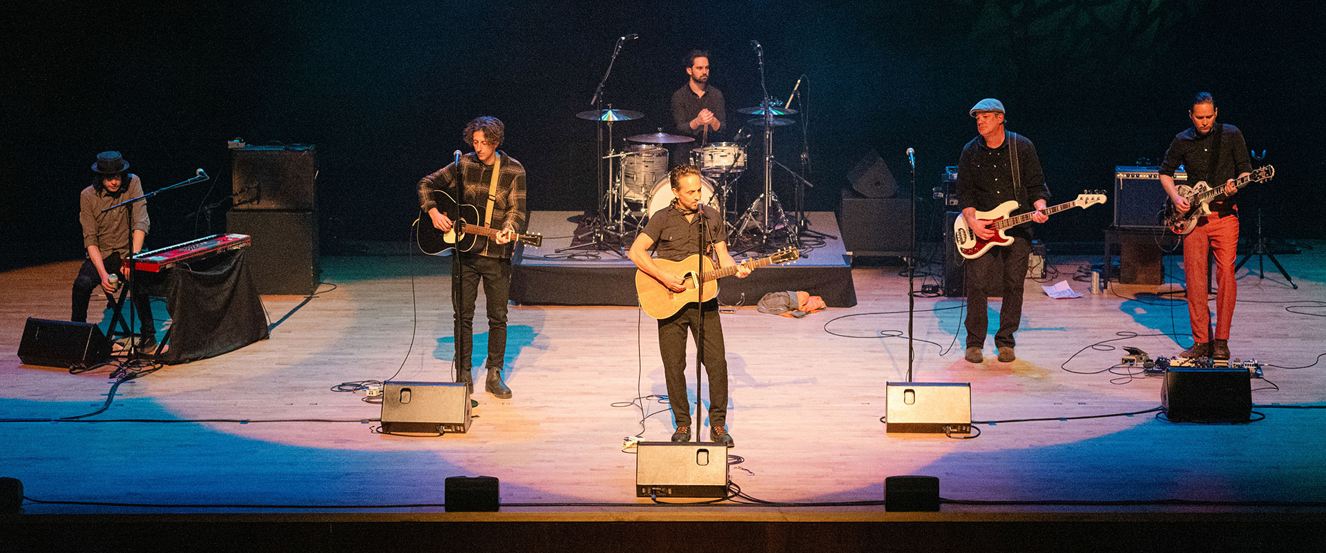 Musical group performing on stage at the JLC