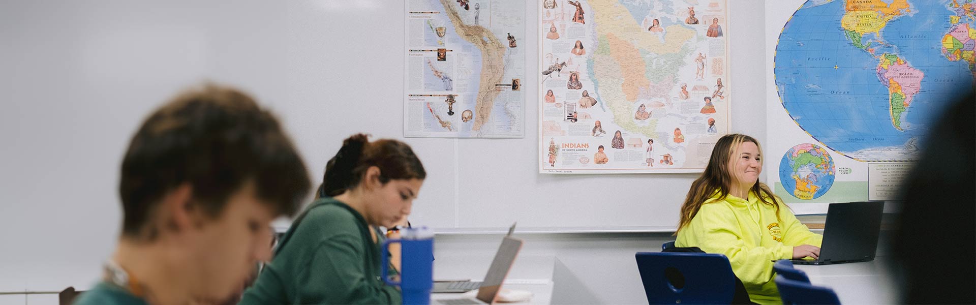 Students in class taking notes