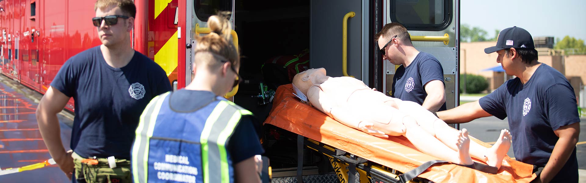 EMT students working with a fake dummy