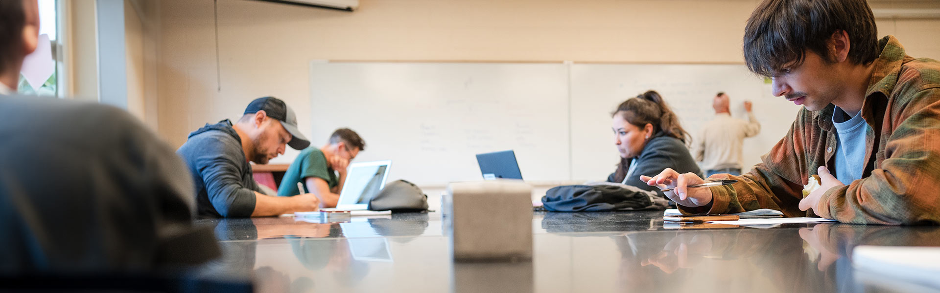 Students working at a communal desk