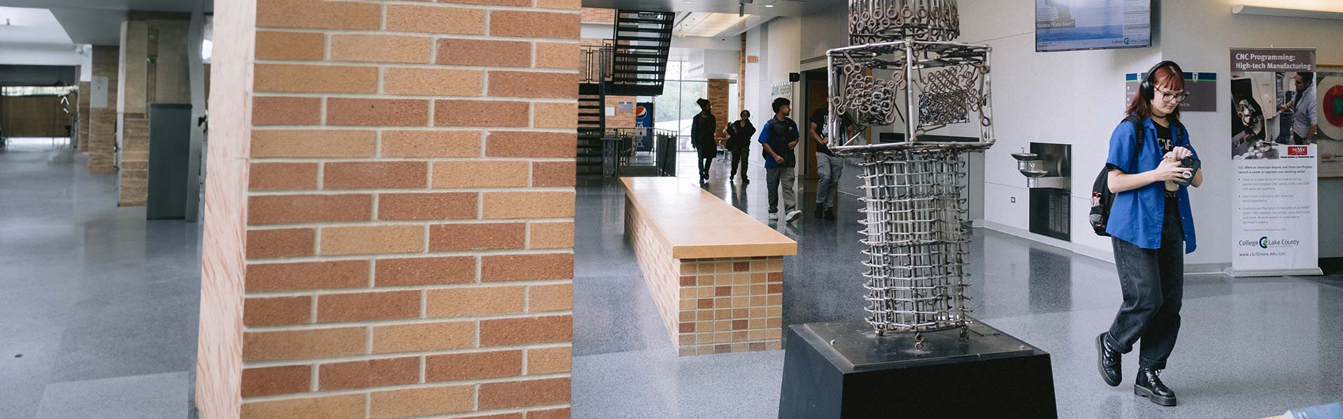 Student walking in a college hallway