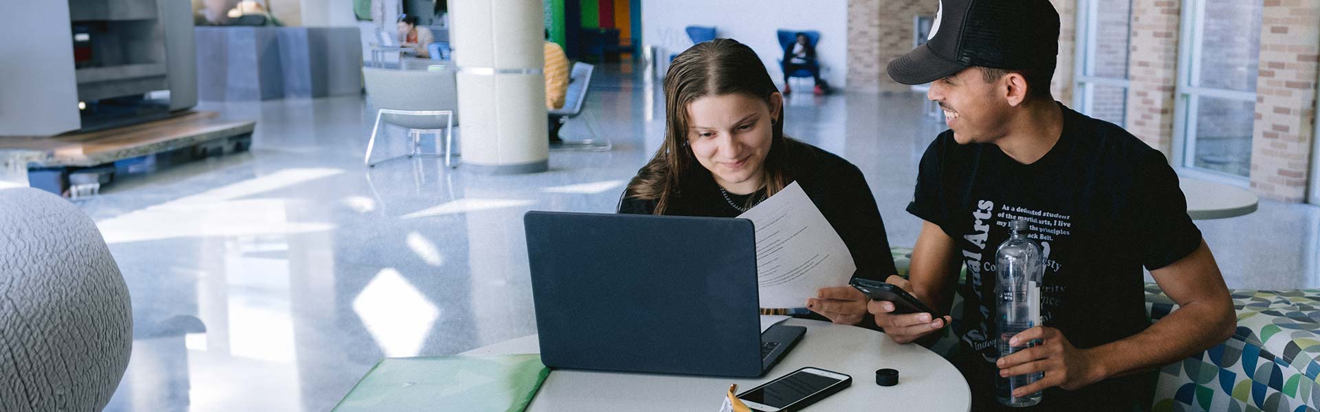 Two students working together studying