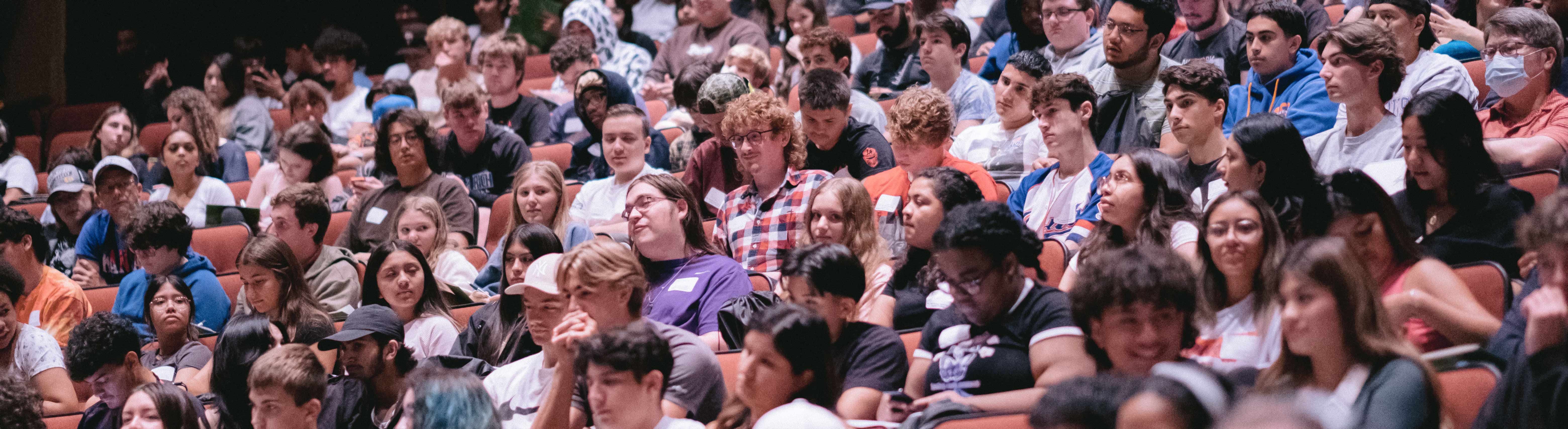 Students sitting in the auditorium