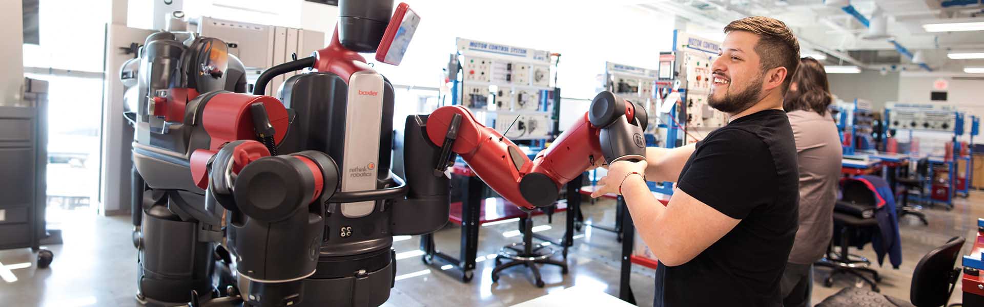 Students working on a robot in a mechatronics lab.