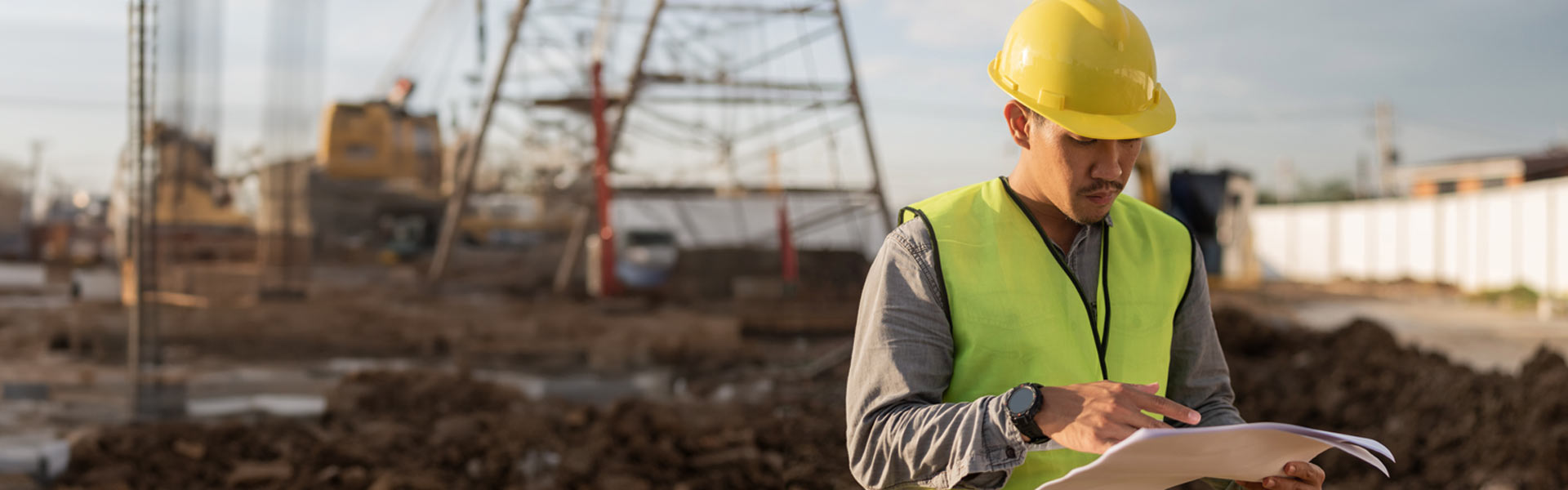 man surveying building site