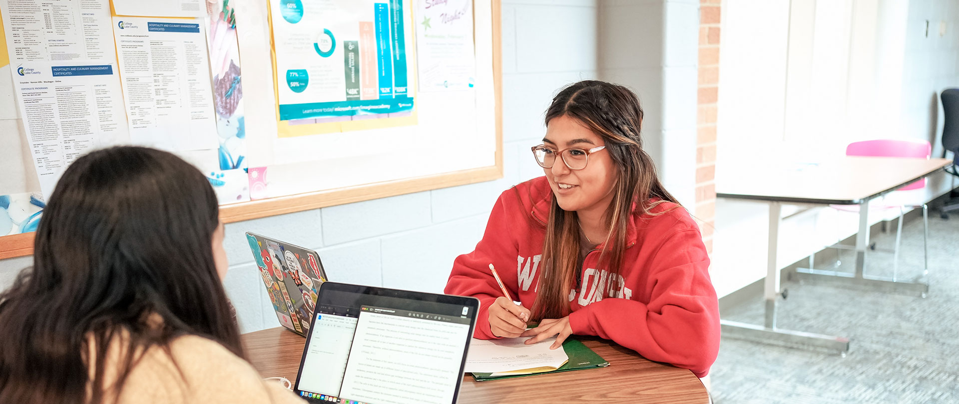 Photo of student getting information.