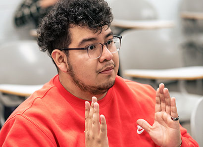 Student practicing sign language.