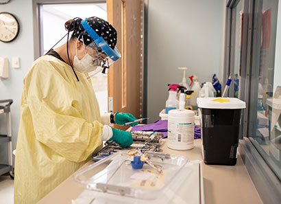 Dental hygiene student preparing tools