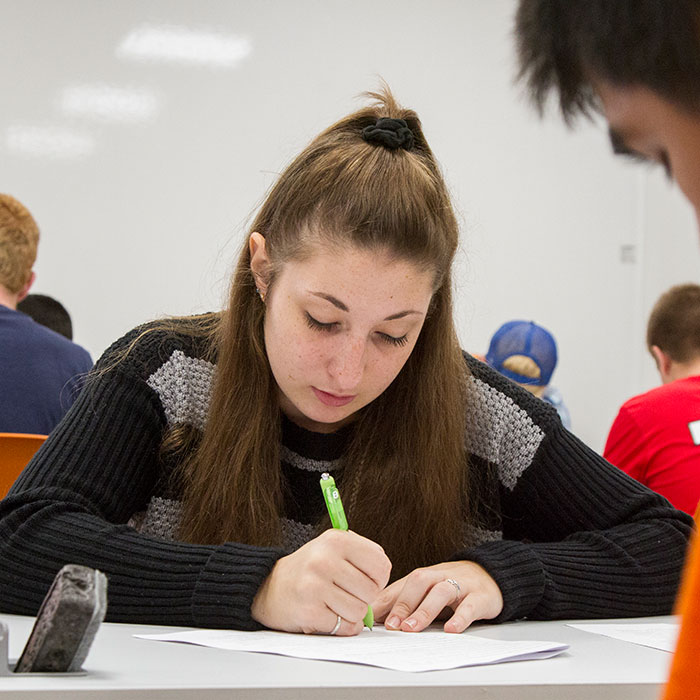 dual-credit-3-700 Female student studying in class.