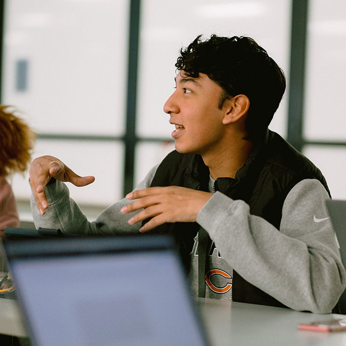 Student talking, engaged in class