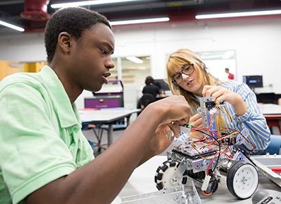 Two students working on an innovation project