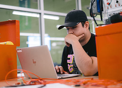 Student intently looking at laptop screen