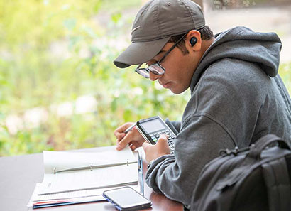 Student using a calculator