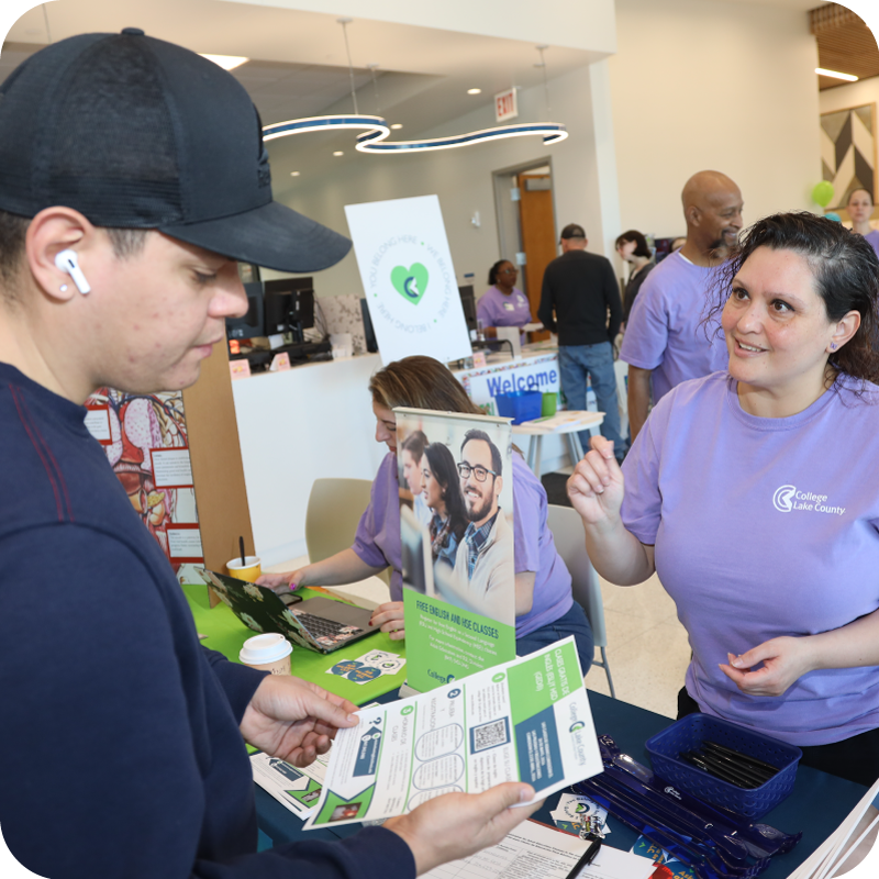 CLC representative speaking with a future student at the Open House