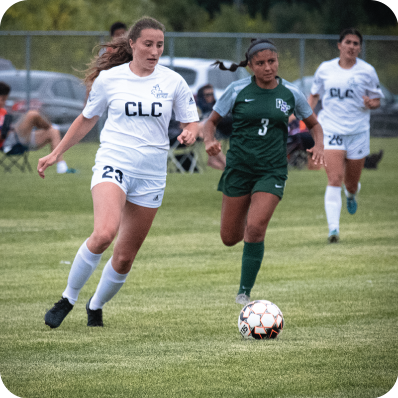 Student playing soccer