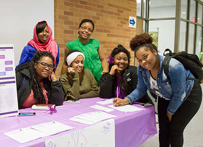 Group of happy students posing