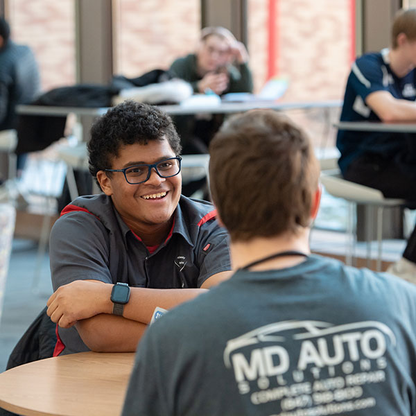 Automotive students hanging out in atrium