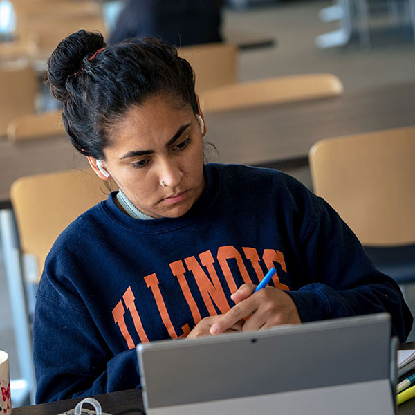 Student wearing university logo sweatshirt