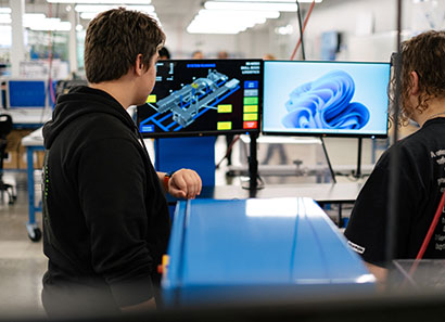ATC open house attendees exploring computer software in lab