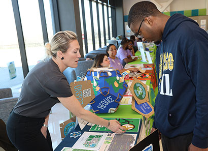 Future student learning about programs at Lakeshore Campus open house