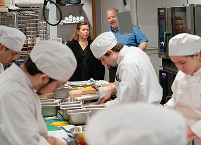 Prairie Restaurant open house attendee touring kitchen