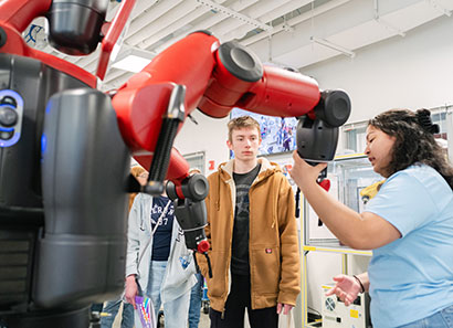 Open house attendees touring the Automation, Robotics and Mechatronics lab