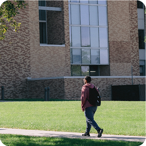 Student walking outside at Grayslake Campus