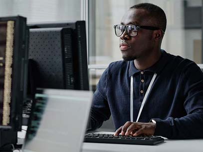 Student focuses on computer monitor