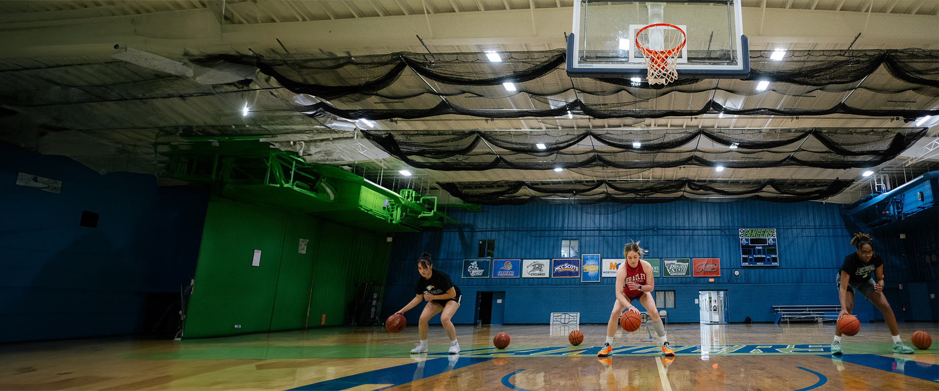 Women basketball players practicing in CLC gym