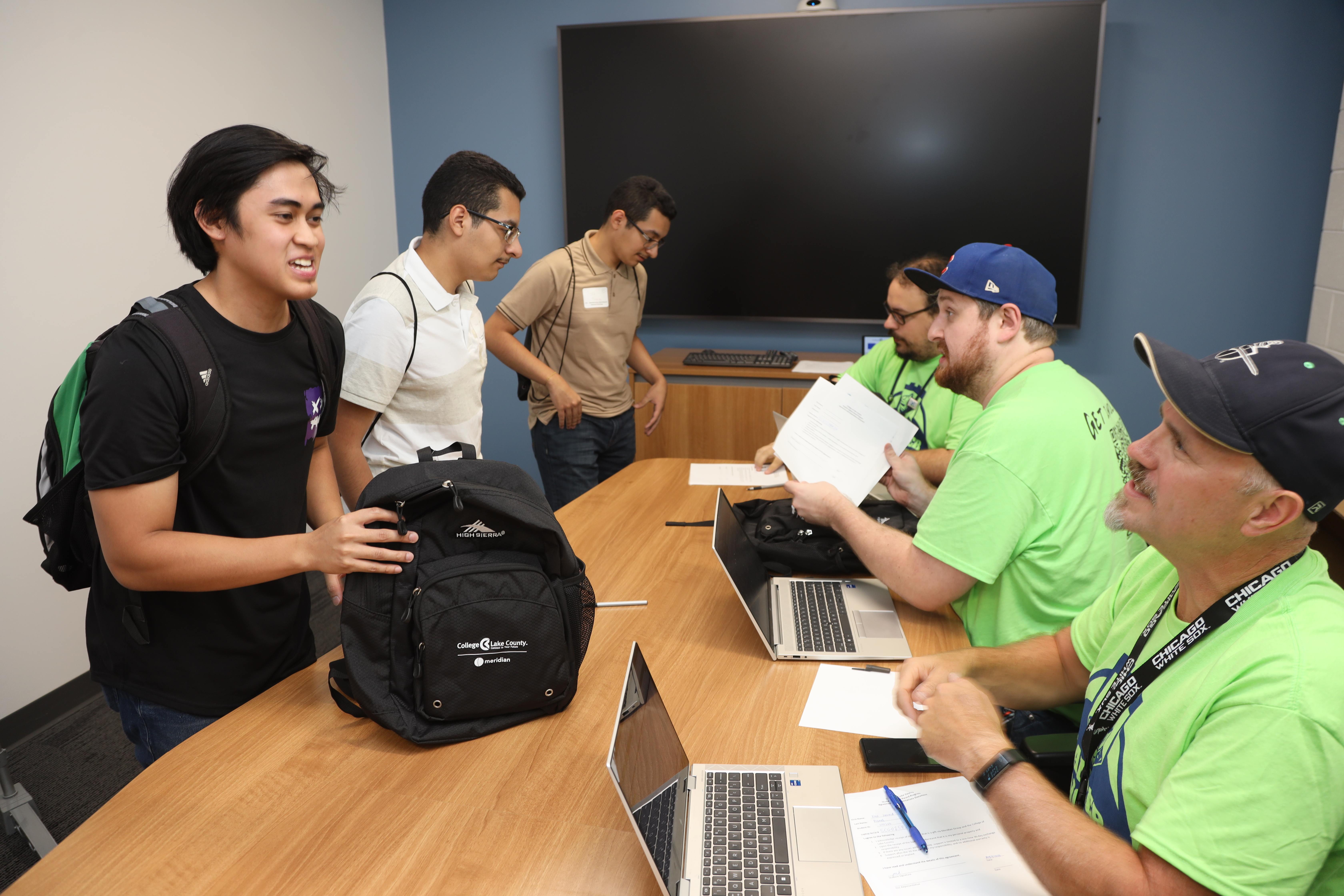 Students receiving laptops