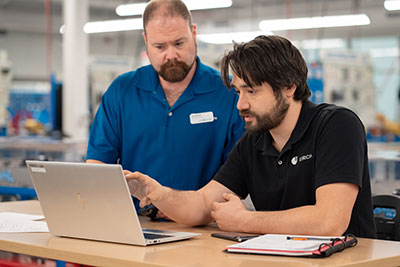 Student and instructor working on the computer