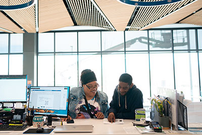 Students getting help at the Welcome and One Stop Center